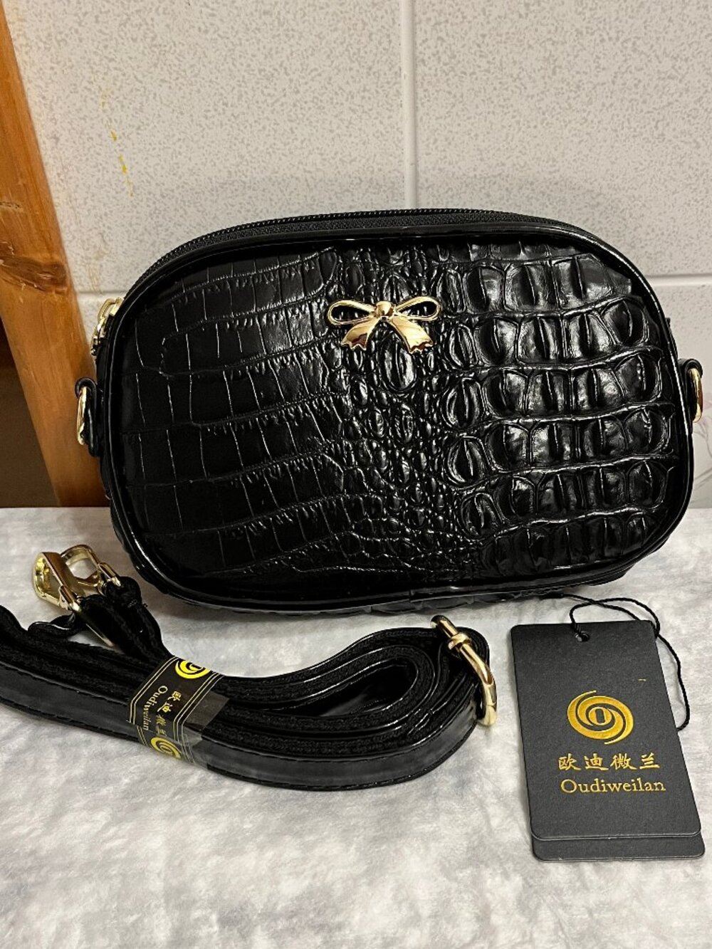 Mini black glossy embossed texture crossbody clutch